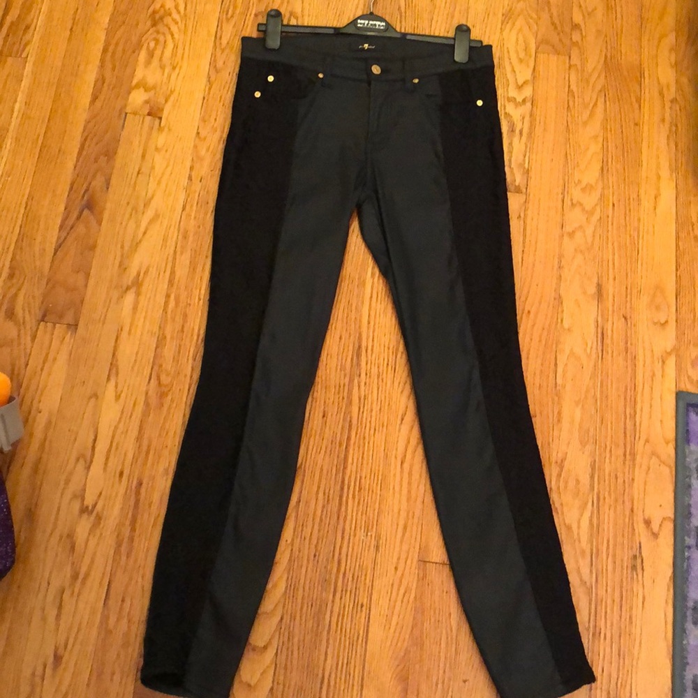 Black jeans with lace trim on the legs.